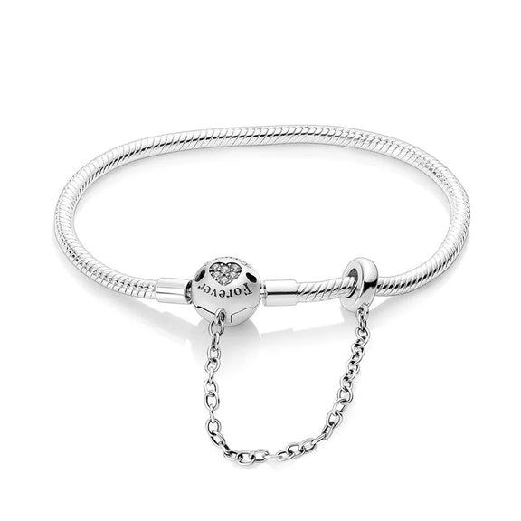 Protective Heart Sterling Silver Snake Chain Charm Bracelet - Protective heart charm sterling silver snake chain bracelet with heart cutout.