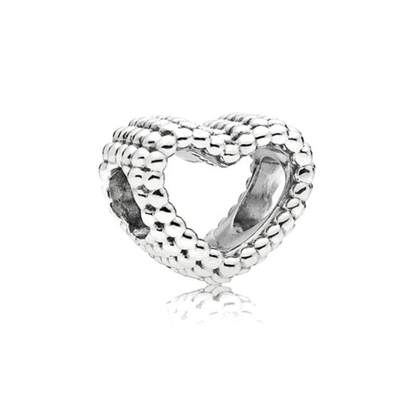 Sterling silver spacer charm with a beaded heart-shaped design.