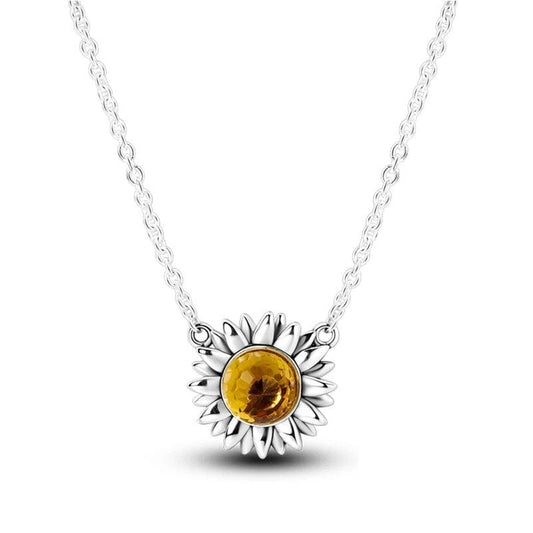 Radiant sunflower pendant necklace featuband a vibrant citrine gemstone.