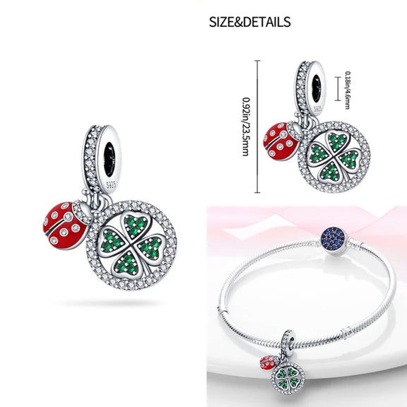 Lucky Charm Clover and Ladybug Sterling Silver Pendant - Sterling silver pendant with a lucky clover and ladybug, adorned with green and red cubic zirconia.