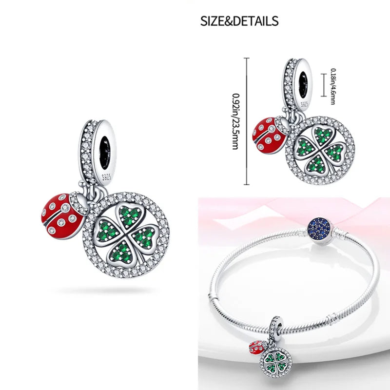 Sterling silver pendant with a lucky clover and ladybug, adorned with green and red cubic zirconia.