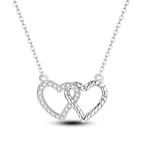 Double Heart Pendant Necklace with Sparkling Crystals - Sterling silver necklace featuring two intertwined heart pendants adorned with crystals.