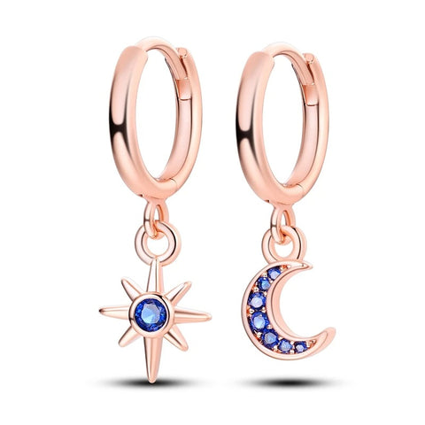 Silver Gold Rose Gold Star Moon Drop Earrings - Sterling silver hoop earrings with star and moon charms adorned with blue stones.