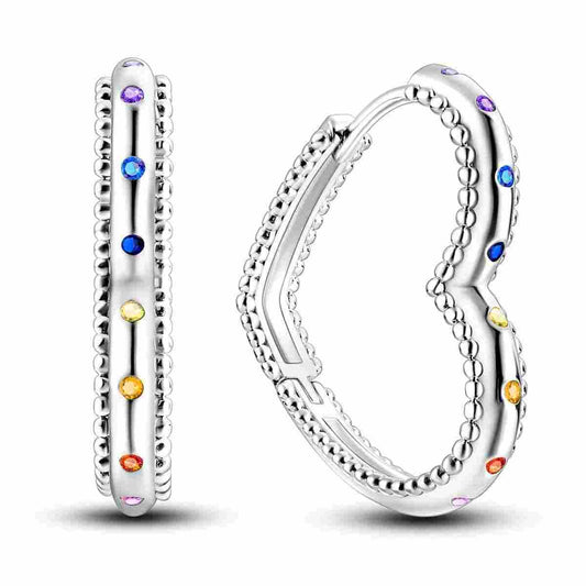 Sterling silver heart-shaped hoop earrings with multicolored stones.