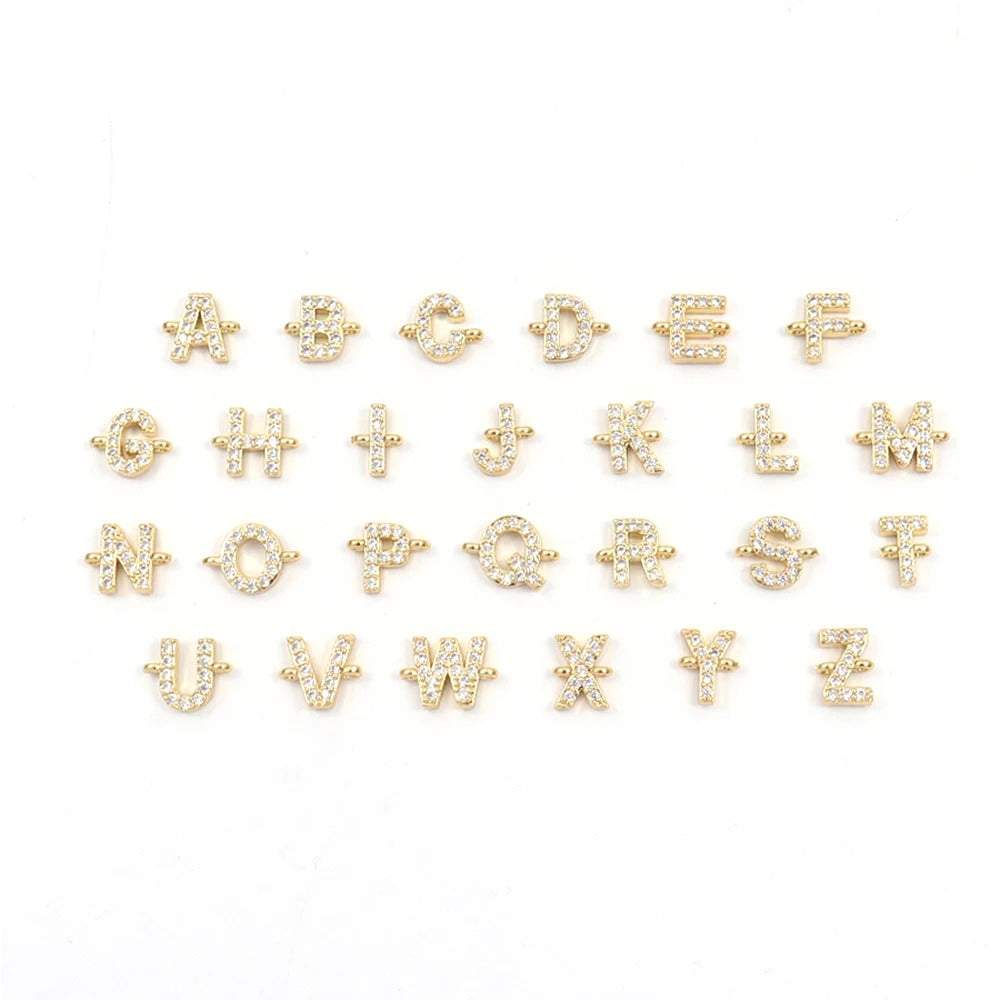 Gold- color crystal initial charms from A to Z for customizable jewelry.