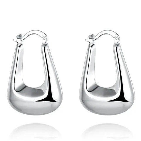 Modern Silver Teardrop Hoop Earrings - Modern silver teardrop hoop earrings on a white background.