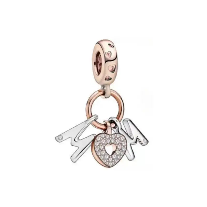 Sterling silver charm with the word "Mom" and a sparkling heart, featuring rose gold-plated accents.