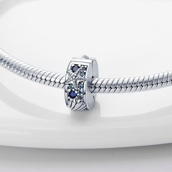 Ocean Starfish and Shell Crystal Charm in Sterling Silver - Blue gemstone charm with starfish and shell design in sterling silver, ideal for adding a touch of the sea to your jewelry collection.