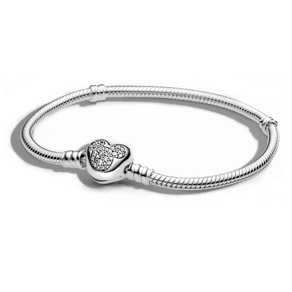 Sterling silver bracelet with a sparkling Mickey Mouse icon charm, compatible with Pandora charms.