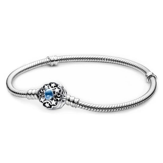 Sterling silver bracelet with a blue sapphire floral charm, compatible with Pandora charms.