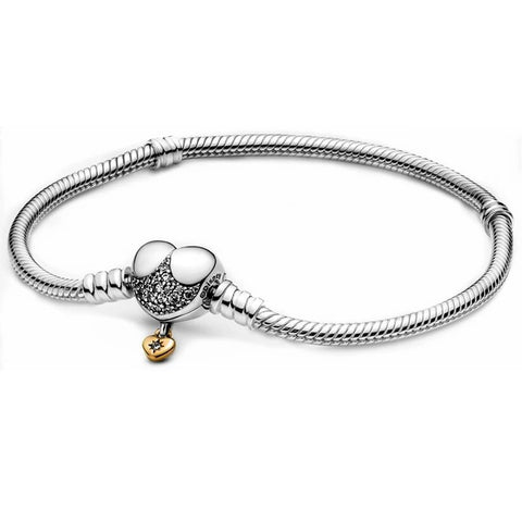 Sterling silver bracelet with a heart-shaped Minnie Mouse charm encrusted with sparkling stones.