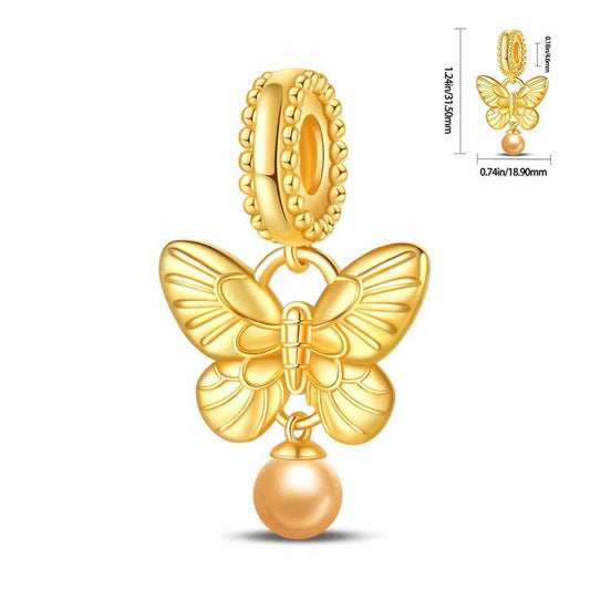 Golden butterfly charm with pearl accent and detailed design.