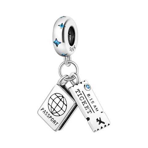 Silver charm with passport and ticket tags on a white background