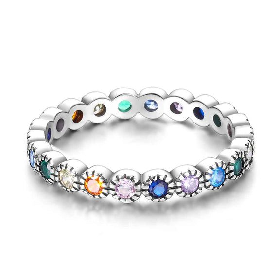 Sterling Silver Rainbow Gemstone Eternity Band - CZ Ring 🌈 - A detailed image of the silver ring with colorful gemstones, showcasing its beauty and the variety of colors in the design