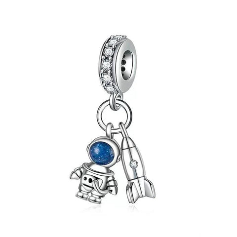 Silver With Blue Astronaut And Rocket Charm - Silver charm with space-themed elements on a white background