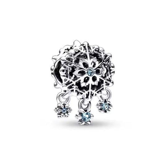 Sterling silver snowflake charm with blue crystals and dangling accents