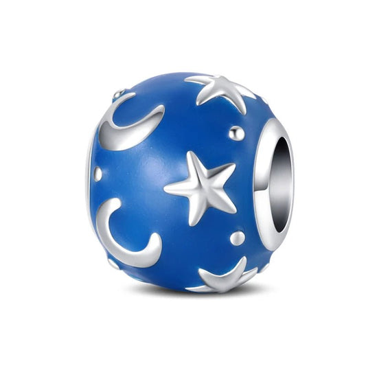 Starry night charm with silver stars and crescent moons on a deep blue enamel background.