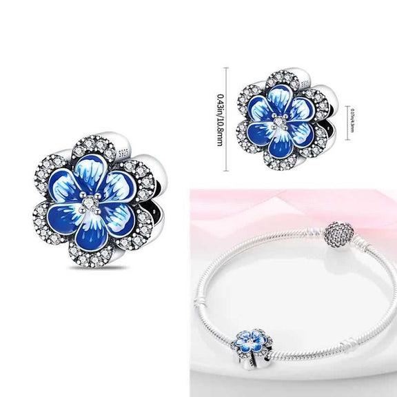 Sterling Silver Blue Enamel Flower Charm with Crystals for Pandora Bracelets - Sterling silver flower charm with blue enamel petals and cubic zirconia accents.