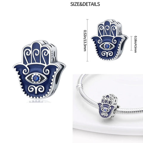 Sterling silver Hamsa hand charm with blue enamel and evil eye design, fits Pandora bracelets.