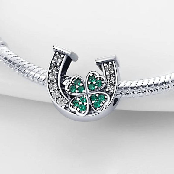 Sterling Silver Horseshoe and Clover Charm for Pandora Bracelets - Sterling silver charm featuring a horseshoe with clear cubic zirconia and a green clover, fits Pandora bracelets.