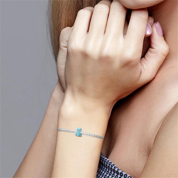 Sterling Silver Luminous Fish Charm for Pandora Bracelets - Woman wearing a bracelet with a sterling silver luminous fish charm.