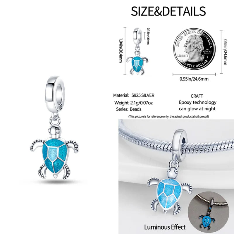 Sterling silver sea turtle charm with vibrant blue enamel details.