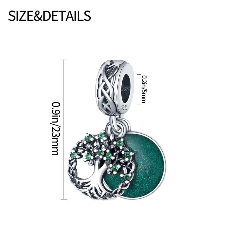 Sterling silver charm for bracelets showcasing a tree of life with green cubic zirconia and a green enamel disc.