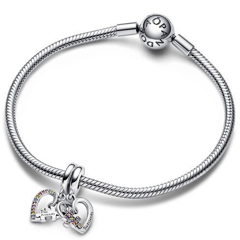 Silver friendship charm with gemstone hearts and "True Friends" puzzle piece, perfect for best friend jewelry.