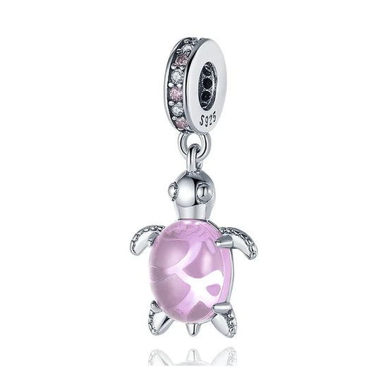 Sterling silver turtle charm with pink enamel shell and rhinestone accents, fits Pandora bracelets.