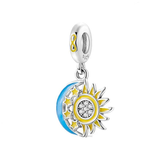 Sterling silver charm featuband a sun, moon, and stars with yellow and blue enamel.