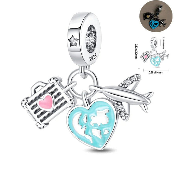 Travel Adventure Charm - Sterling silver charm featuring a suitcase, airplane, and heart-shaped globe with enamel accents.