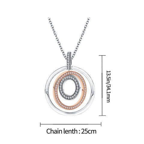 Elegant circular pendant necklace with three concentric rings in silver, rose gold, and diamond-encrusted silver, displayed on a white background with dimensions.