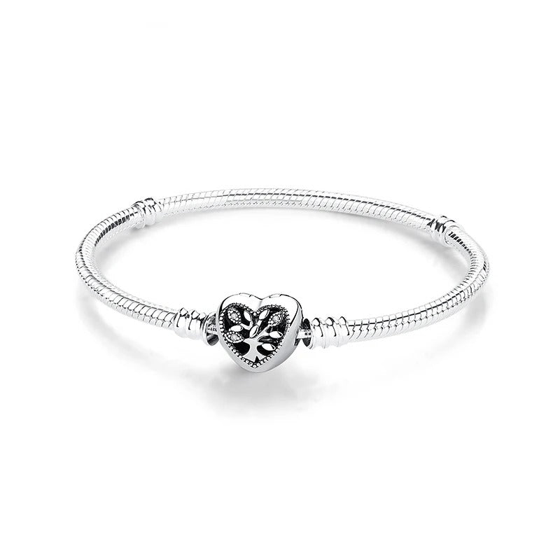 Filigree heart sterling silver snake chain charm bracelet with intricate detailing