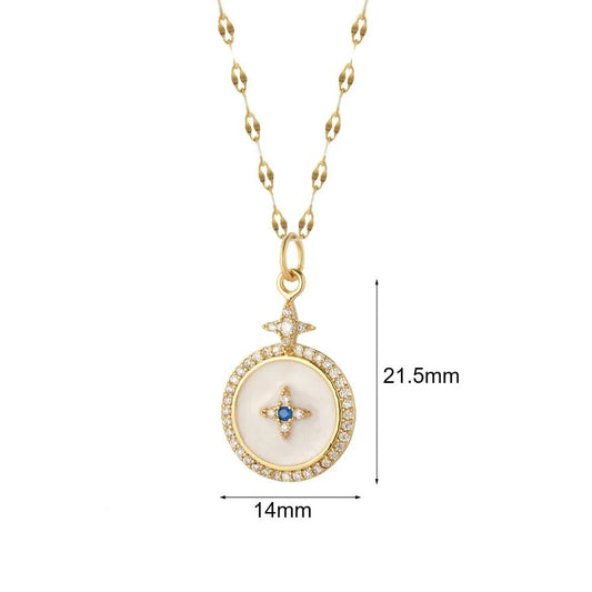 Gold-plated starburst pendant necklace with white enamel and crystal accents, pendant measures .