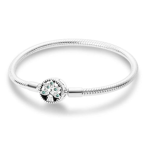 Tree Life Sterling Silver Charm Bracelet - Sterling silver bracelet with a Tree of Life charm and green gemstones.