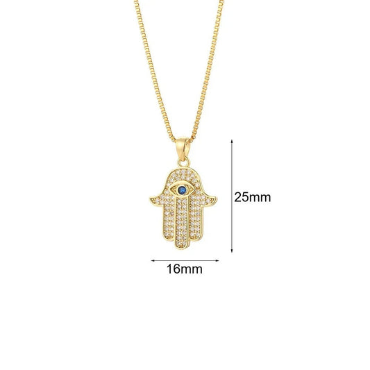 Gold-plated Hamsa hand pendant necklace with crystals and a blue eye centerpiece.