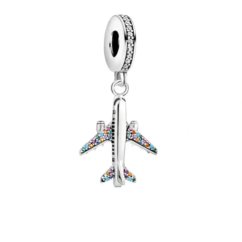 Silver airplane charm with colorful stones.