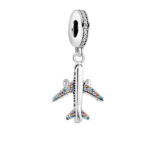 Silver airplane charm with colorful stones.