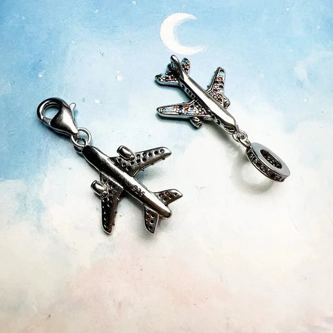 Two airplane charms.
