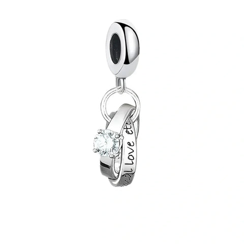 Silver charm with interlocking rings.