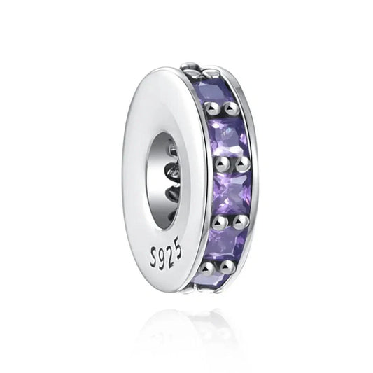 Sterling silver spacer charm with amethyst cubic zirconia stones for added color and elegance.