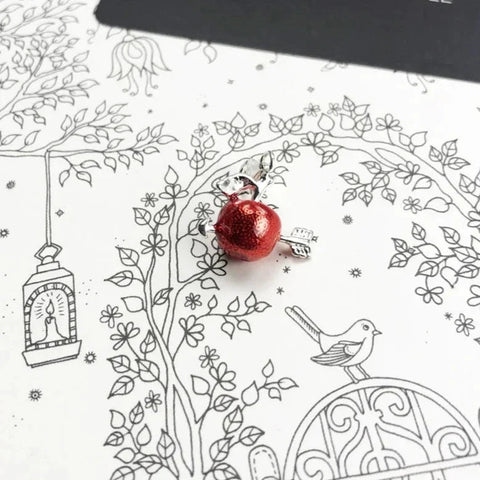 Sparkly red apple charm.