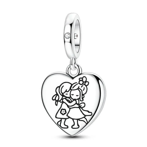 Best Friends Hugging Heart Dangle Charm, Sterling Silver - Sterling silver heart-shaped dangle charm engraved with two girls hugging, attached to a polished bail with a small clear crystal, shown on white background