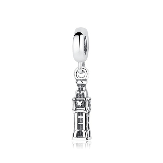 A sterling silver dangle charm depicting the Big Ben clock tower with detailed architectural engraving, hanging from a smooth clip-on bail