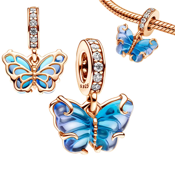 Blue Butterfly Charm with Sparkling Crystal Accents - Blue Butterfly Charm in rose gold with blue enamel wings and sparkling crystals, perfect for expressing beauty and transformation.