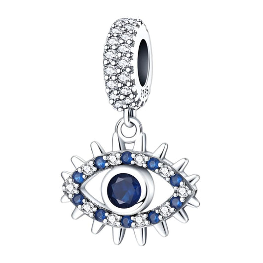 Sterling silver evil eye charm with a blue central crystal and pave detailing, perfect for charm bracelets or necklaces.