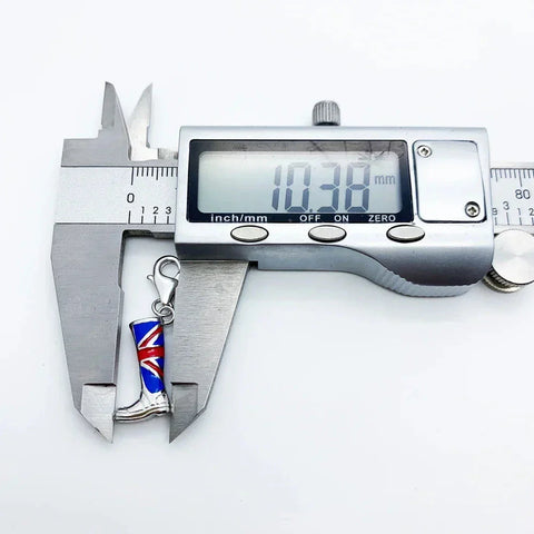 Digital caliper measuring a boot charm.