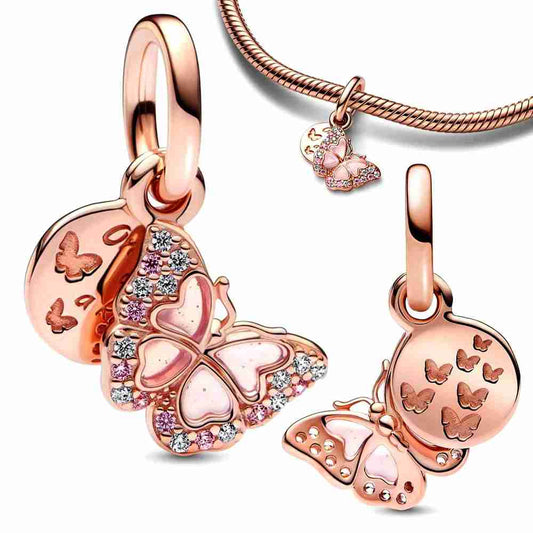 Rose gold butterfly charm with pink enamel and crystals, symbolizing transformation and beauty.