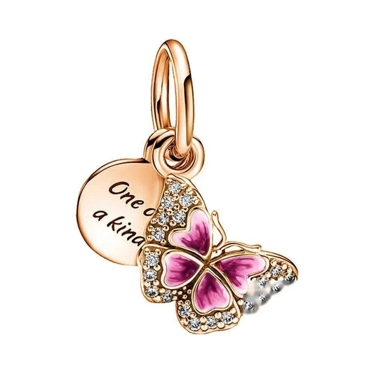 Butterfly pendant charm with 'One of a Kind' tag and pink enamel