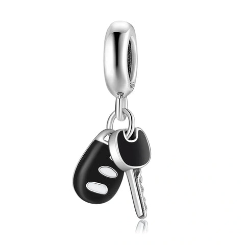 Silver car key charm.